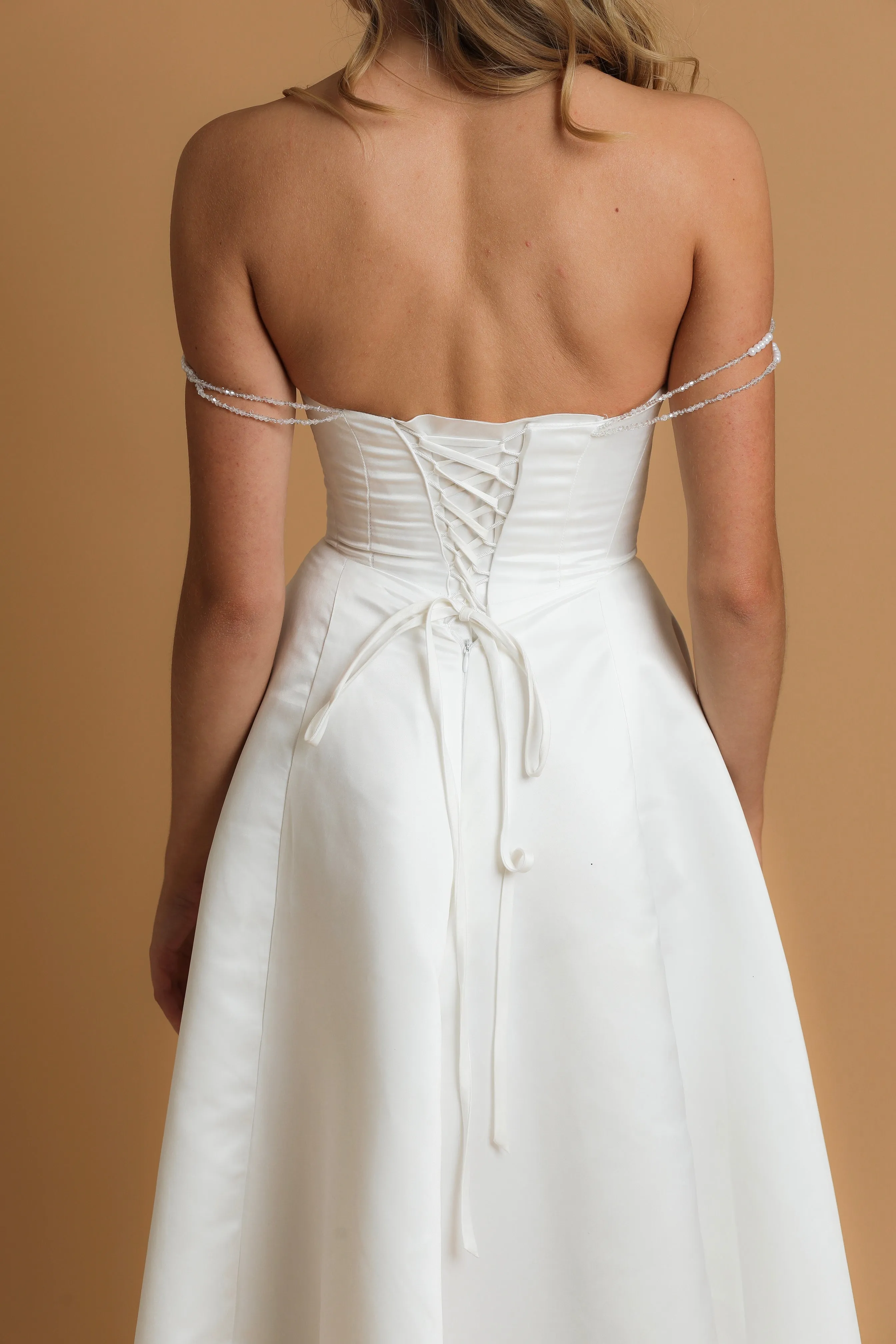 white dress with cut out neckline detail for hire